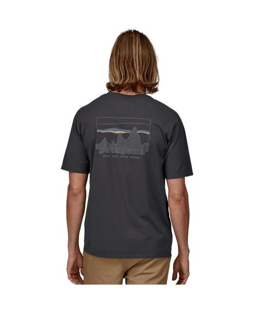 Person wearing a dark gray t-shirt with a graphic design on the back, standing against a transparent background.