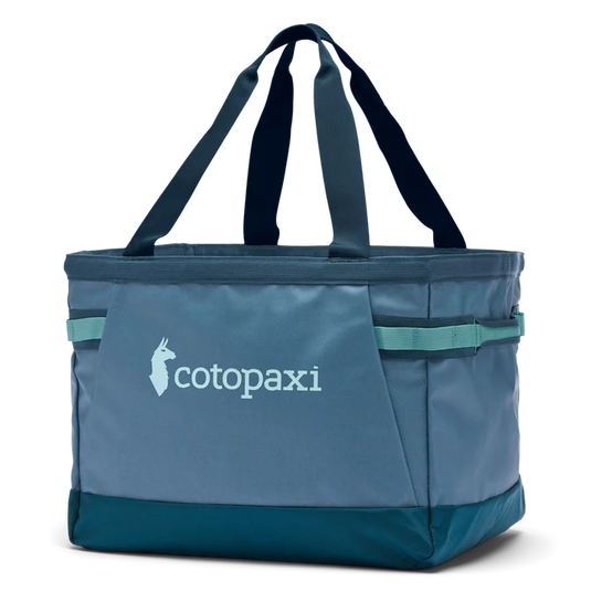 A blue Cotopaxi Allpa 30L Gear Hauler Tote with brand logo visible on the side.