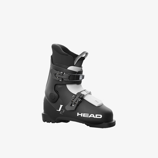 A black and white Head J2 Junior Ski Boot with multiple buckles and branding on the side.