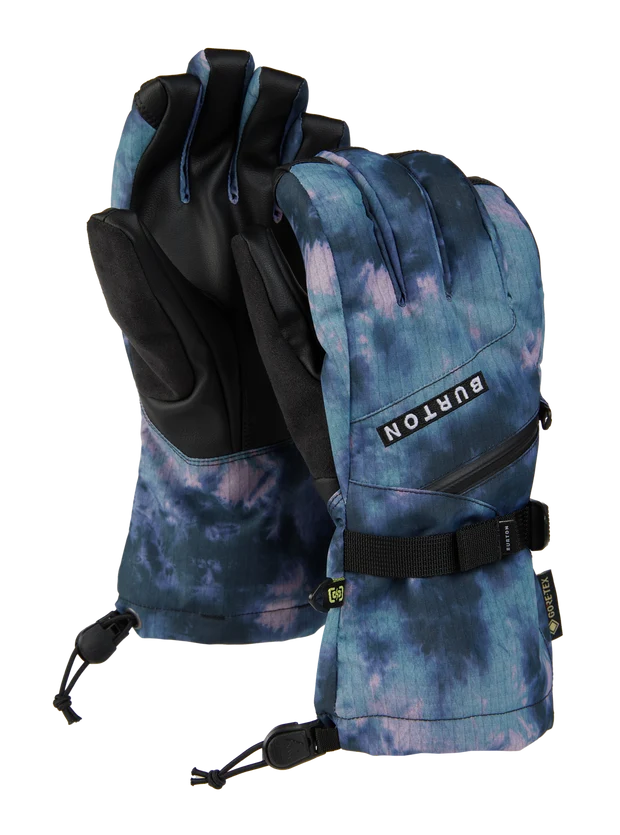 Load image into Gallery viewer, A pair of Burton snow gloves featuring a blue and purple tie-dye pattern on the outer shell and black palms, with a black wrist strap and adjustable drawstrings, shown against a plain white background. Ski and Tennis Station
