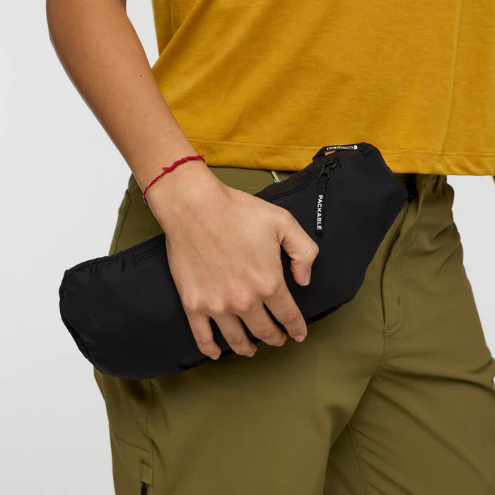 Load image into Gallery viewer, Person holding a black jacket pack bag
