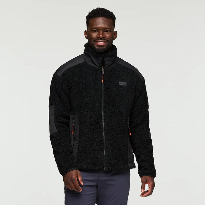 Man wearing a black jacket with gray accents on a white background