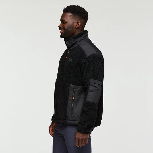 Man wearing a black and gray jacket on a white background