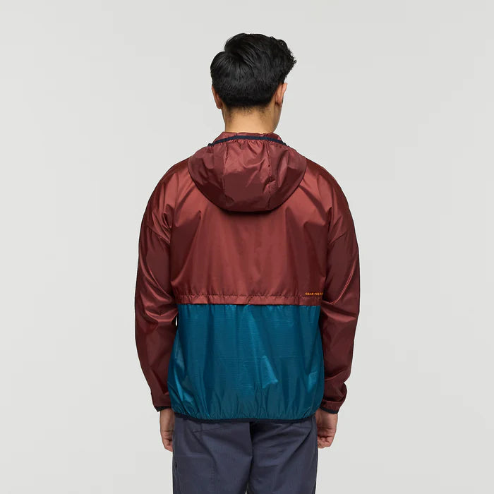 Load image into Gallery viewer, Person wearing a two-tone jacket with maroon upper half and blue lower half on a light gray background
