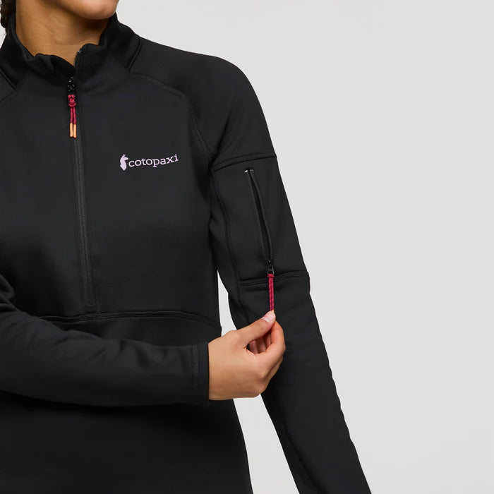 Load image into Gallery viewer, Black jacket with Cotopaxi logo on a gray background
