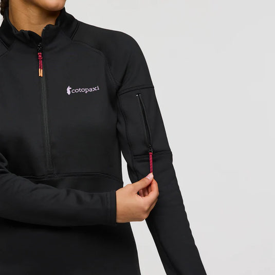 Black jacket with Cotopaxi logo on a gray background