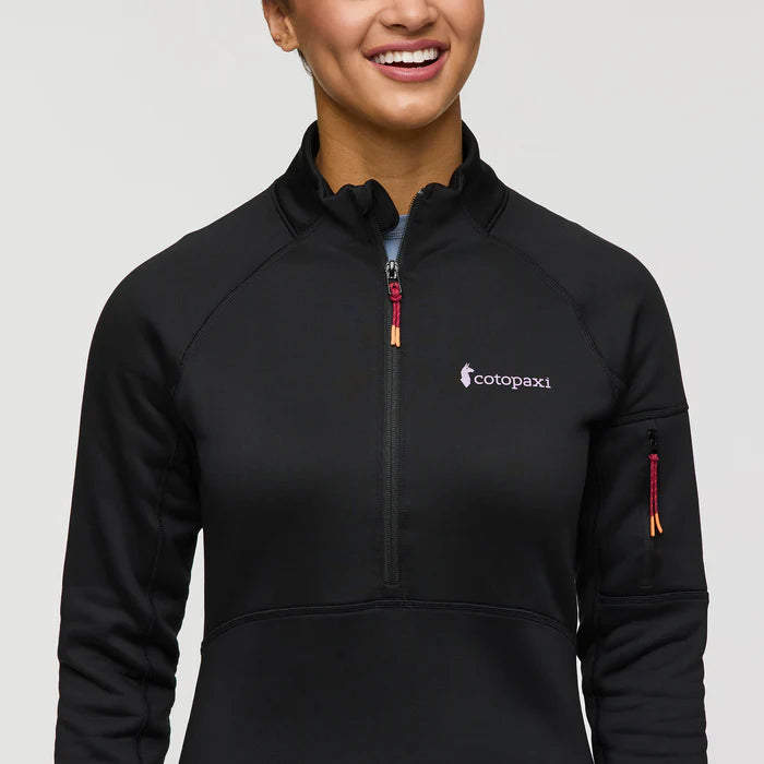 Load image into Gallery viewer, Person wearing a black jacket with a Cotopaxi logo on a plain background
