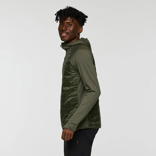 Person wearing a green jacket on a white background