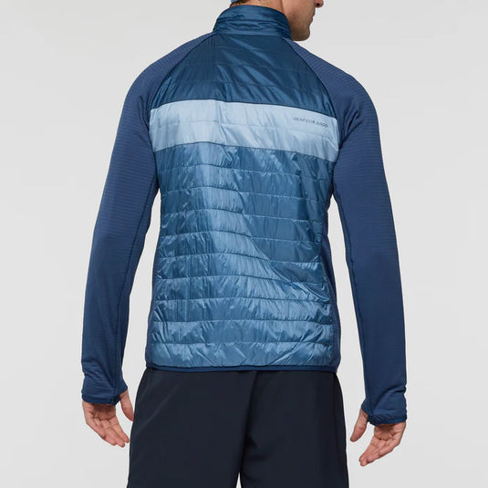 Blue puffer jacket on a light gray background