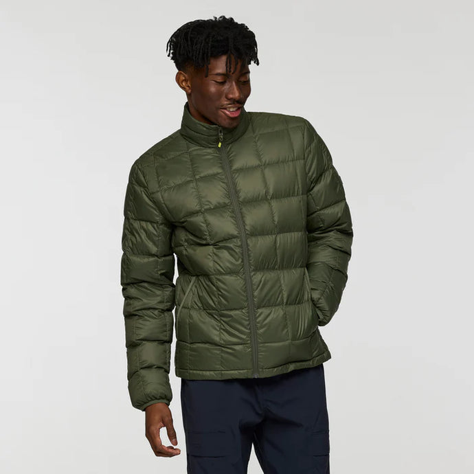 Person wearing a green puffer jacket on a white background