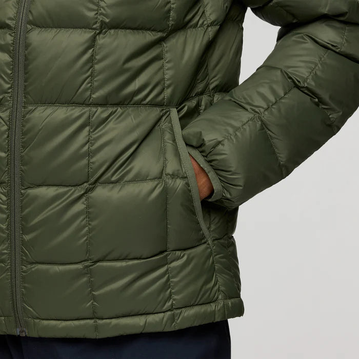Load image into Gallery viewer, Green puffer jacket on a gray background
