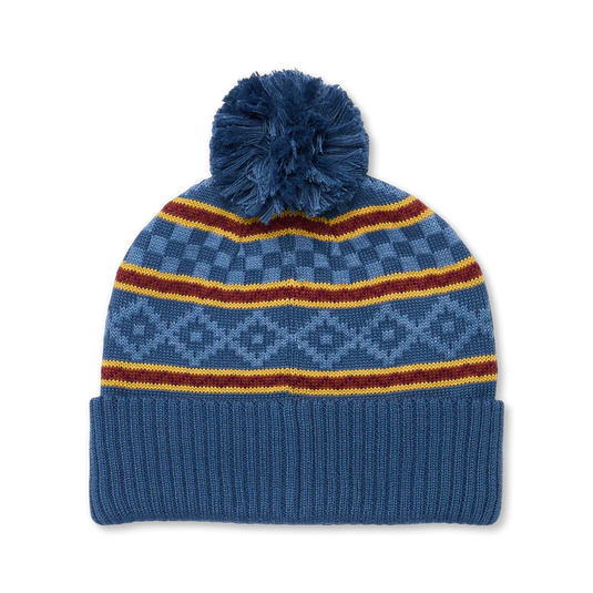 Blue knit beanie with pom-pom and colorful stripes on a white background