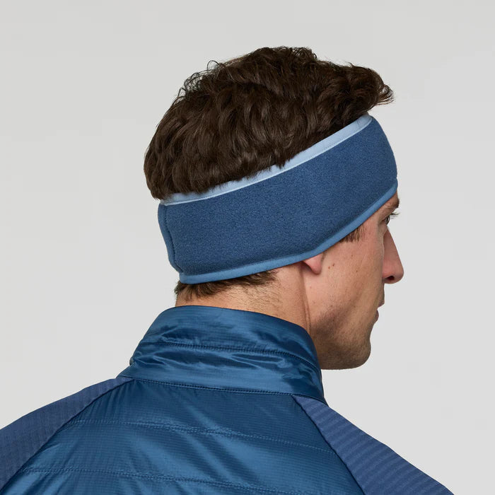 Load image into Gallery viewer, Person wearing a blue headband and jacket against a gray background

