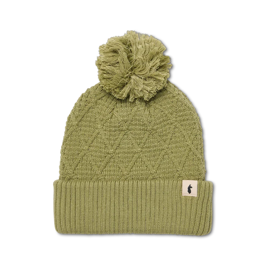 Green knit beanie with pom-pom on a white background