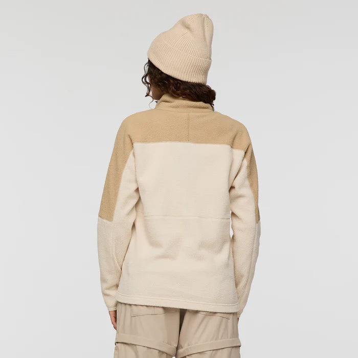 Load image into Gallery viewer, Person wearing a beige and white fleece jacket with a matching beanie on a plain background
