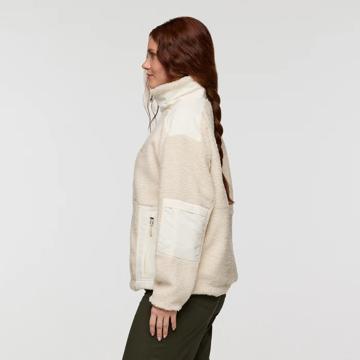 Load image into Gallery viewer, Woman wearing a cream-colored fleece jacket on a plain background
