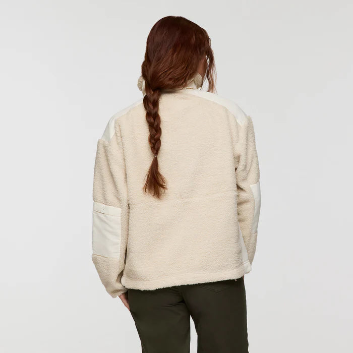 Load image into Gallery viewer, Woman wearing a cream-colored fleece jacket on a plain background
