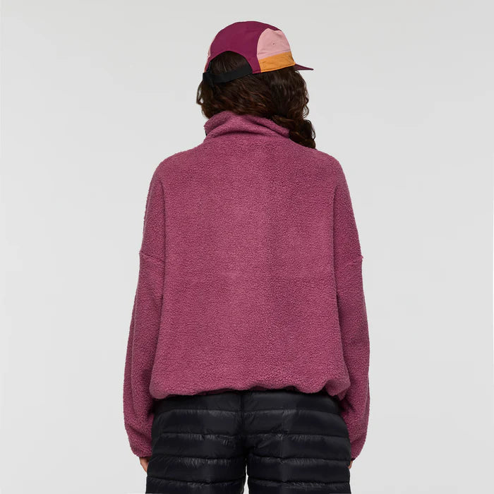 Load image into Gallery viewer, Person wearing a pink fleece pullover and colorful cap on a white background
