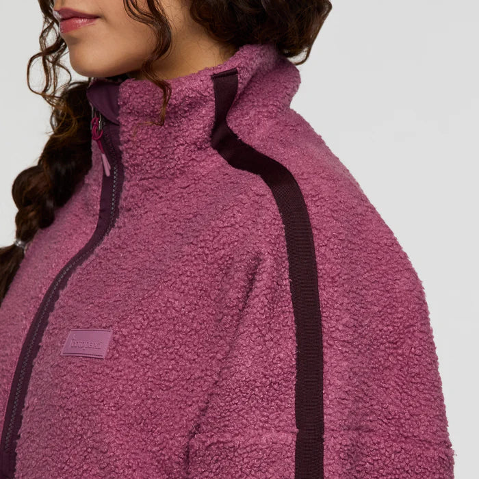Load image into Gallery viewer, Close-up of a person wearing a pink fleece jacket with a plain background

