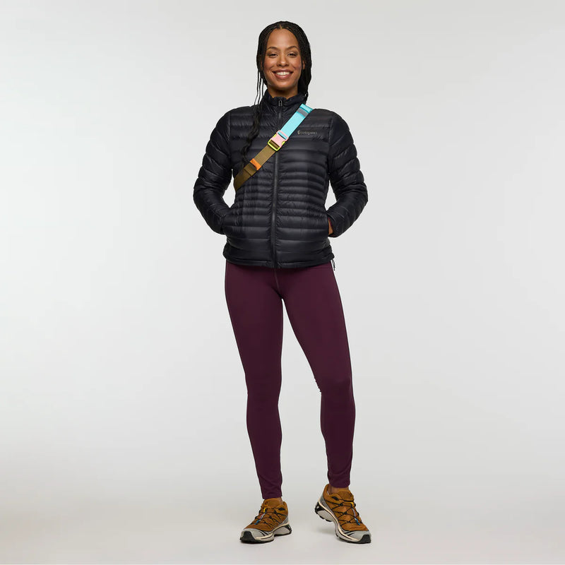 Load image into Gallery viewer, Person wearing a black puffer jacket, maroon leggings, and brown shoes on a white background
