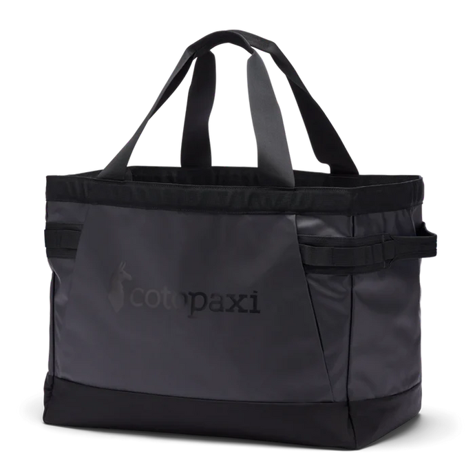 Black tote bag with 'cotopaxi' logo on a white background