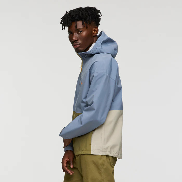 Load image into Gallery viewer, Person wearing a two-tone jacket with blue and beige sections on a plain background
