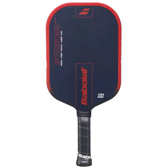 A Babolat Striker pickleball paddle in navy blue and red, featuring a black grip handle, shown against a solid black background. Ski and Tennis Station
