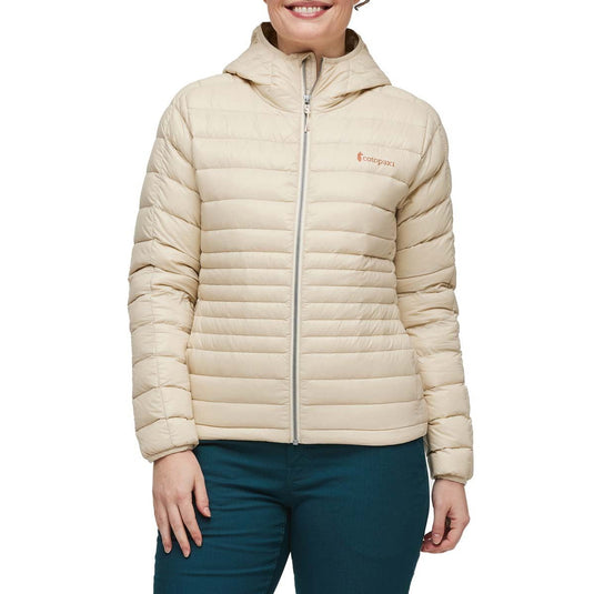 Beige puffer jacket worn by a person on a white background