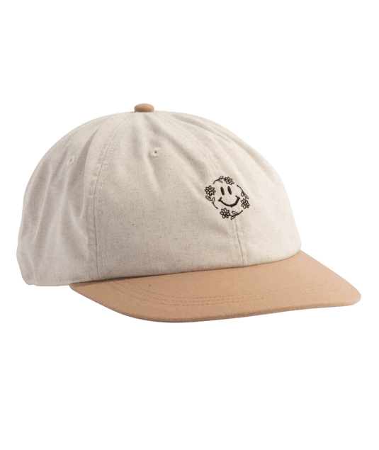 Beige cap with a smiling face logo on a white background