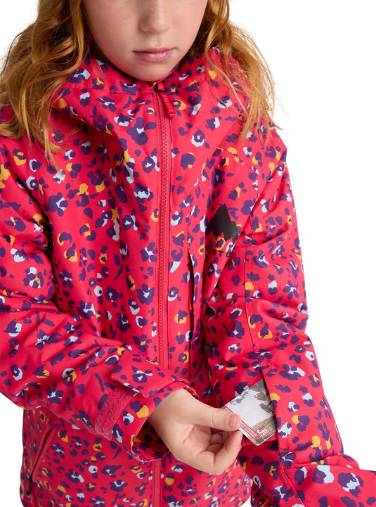 Child wearing a red patterned Burton jacket on a white background
