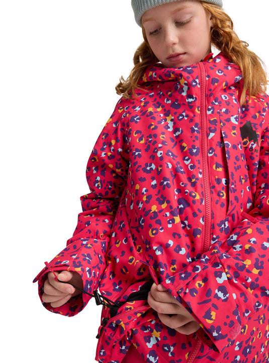 Child wearing a pink patterned jacket on a white background