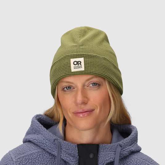 Textured green beanie on female model