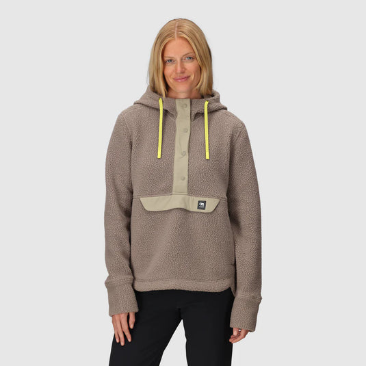 Woman wearing a brown fleece pullover with a hood on a white background