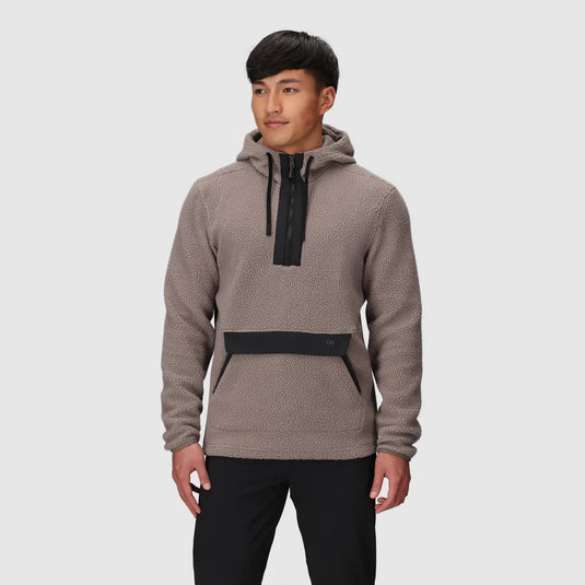 Man wearing a brown hoodie with black accents on a white background