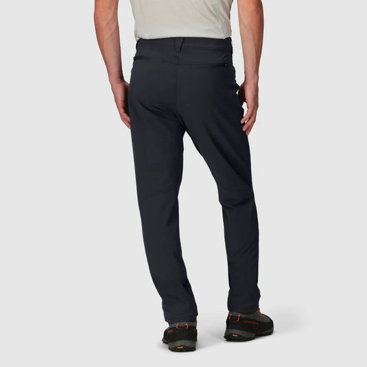 Person wearing black pants on a white background