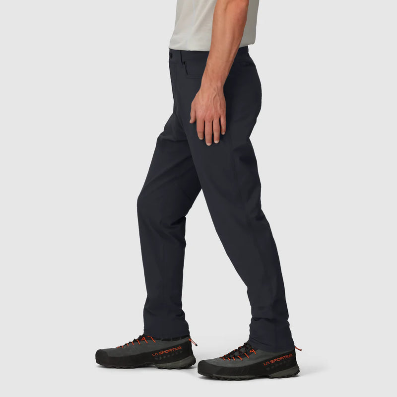Load image into Gallery viewer, Person wearing black pants and black shoes with orange accents on a light gray background
