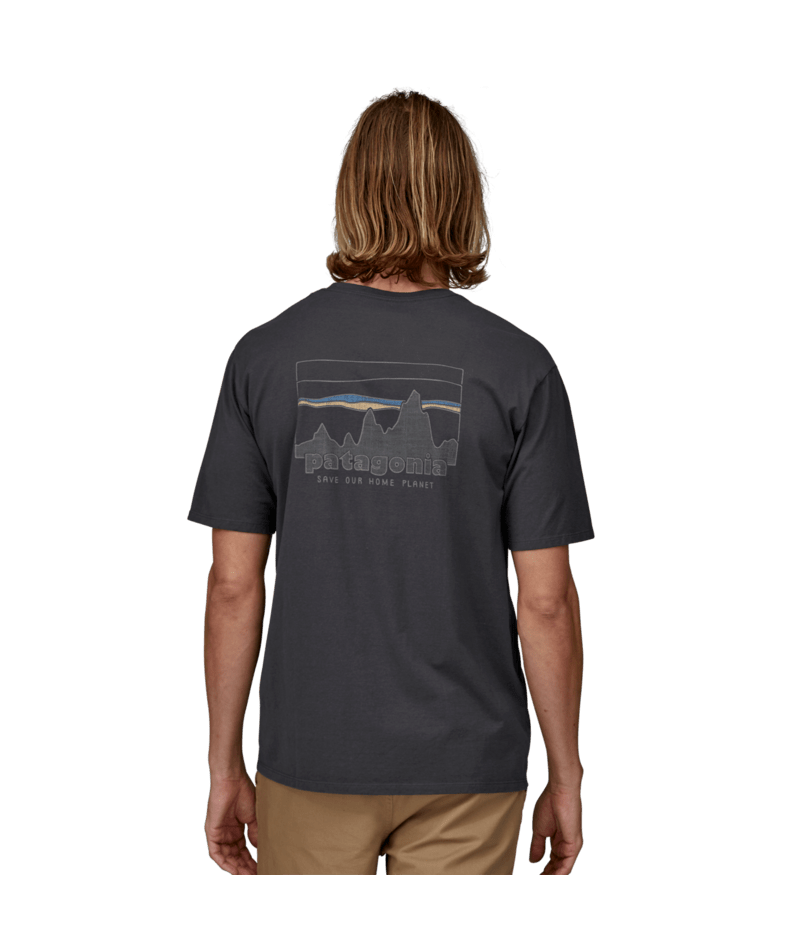 Load image into Gallery viewer, Person wearing a dark gray t-shirt with a graphic design on the back, standing against a transparent background.
