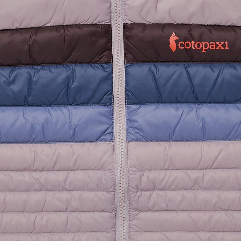 Load image into Gallery viewer, Close-up of a quilted jacket with visible Cotopaxi logo.
