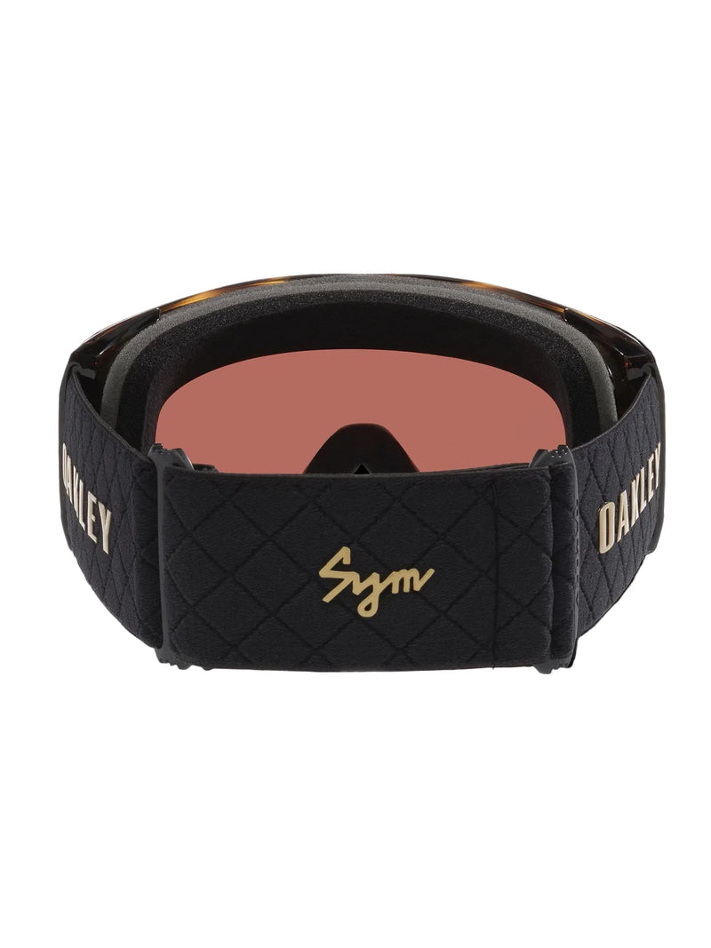 Load image into Gallery viewer, Black quilted Oakley Sym ski goggles with a rose gold mirrored lens and gold branding on the strap.
