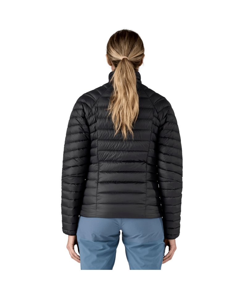 Load image into Gallery viewer, Person wearing a black puffer jacket and blue pants on a transparent background
