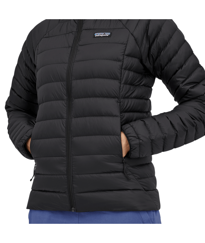 Load image into Gallery viewer, Black puffer jacket with Patagonia logo on a transparent background
