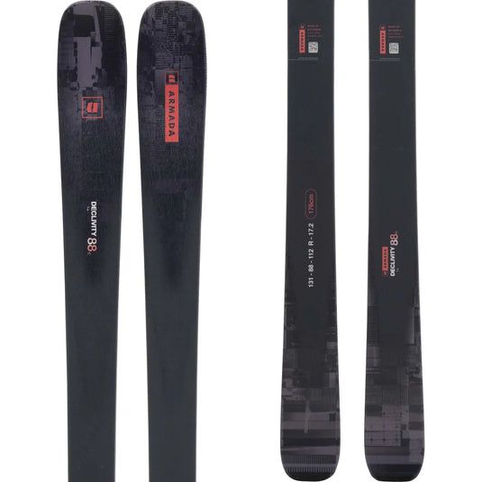 Two black skis with red branding on a white background