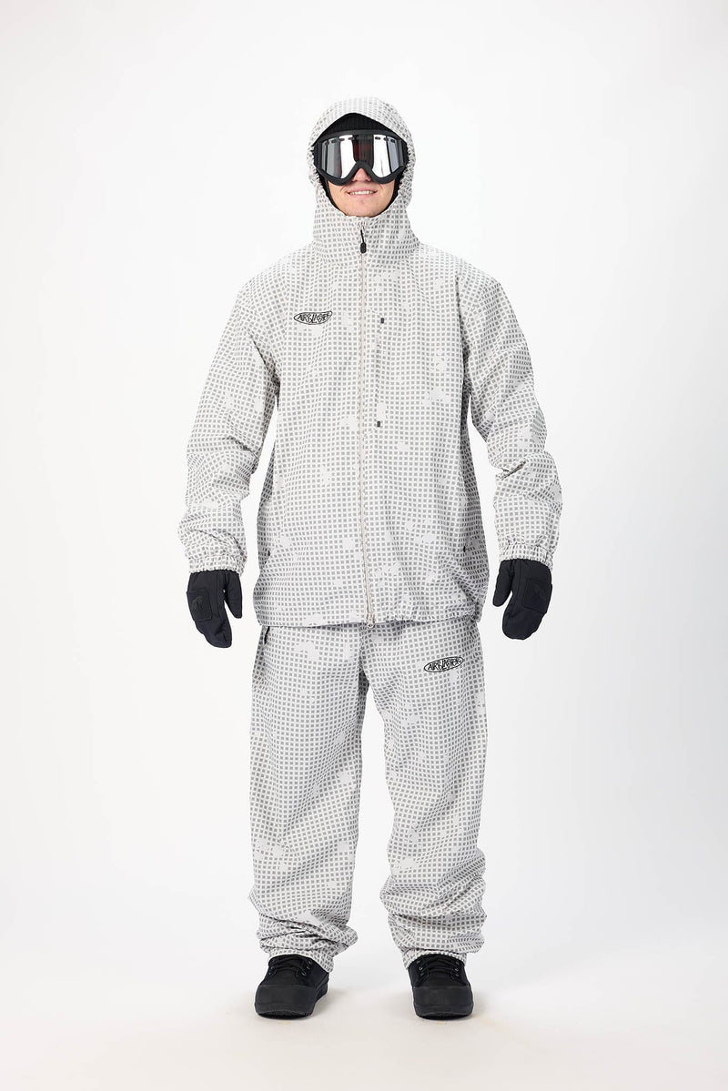 Load image into Gallery viewer, A person modeling a light gray and white checkered Airblaster snowsuit with the Beast Access jacket and hood. Ski and Tennis Station
