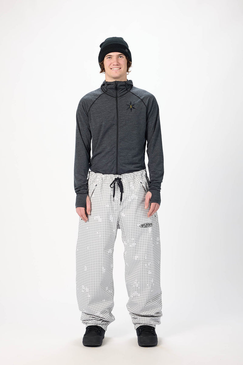 Load image into Gallery viewer, A man modeling Airblaster gray checkered snow pants. Ski and Tennis Station
