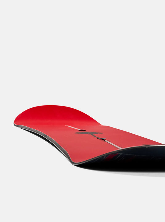 Red and black snowboard on a white background