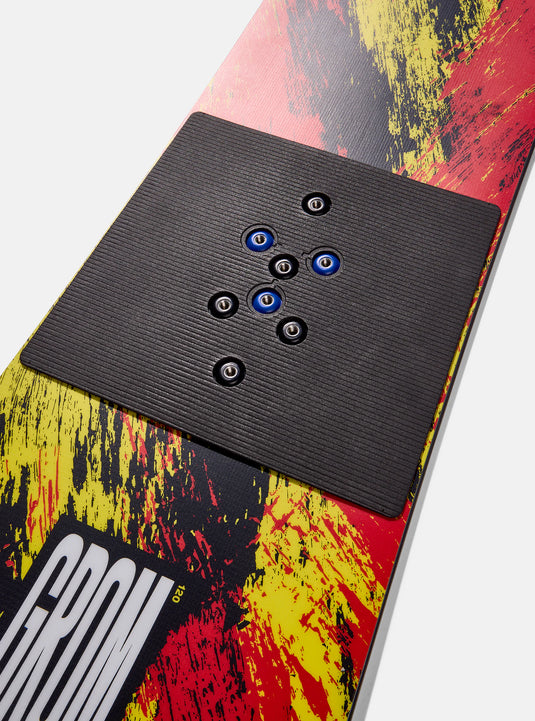 Close-up of a snowboard with a control panel and colorful design
