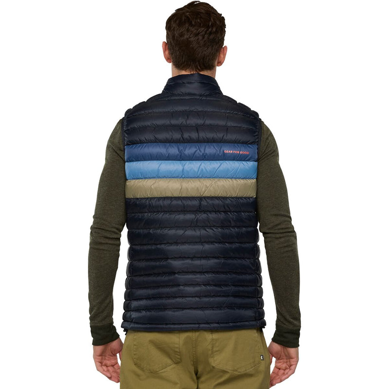 Load image into Gallery viewer, Person wearing a dark blue puffer vest with color-blocked design on a white background
