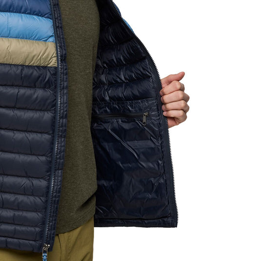 Close-up of a person wearing an unzipped Cotopaxi puffer jacket