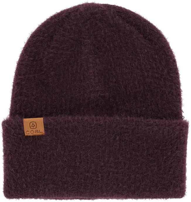 A purple beanie with a thick knit texture and a leather brand tag on the side.