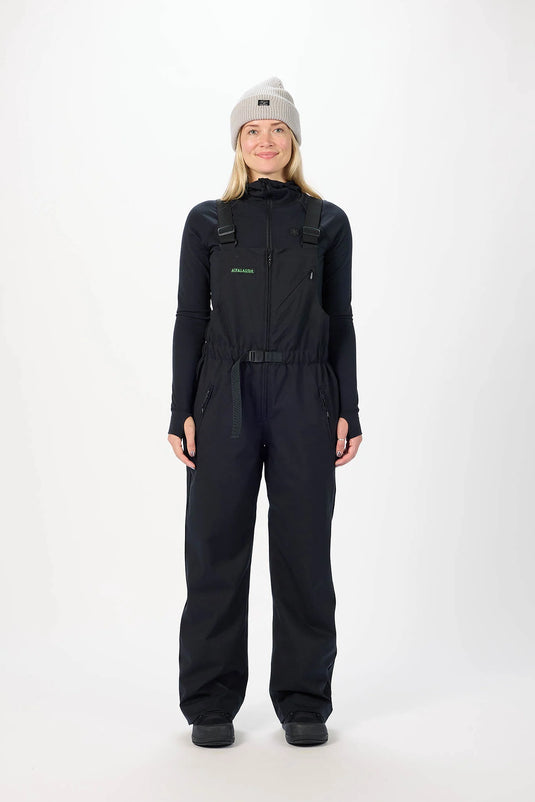Person wearing a black Airblaster snowsuit featuring the Every Body bib. Ski and Tennis Station